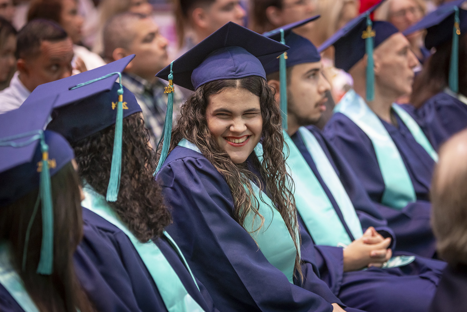 Laura Moran celebrates with fellow graduates