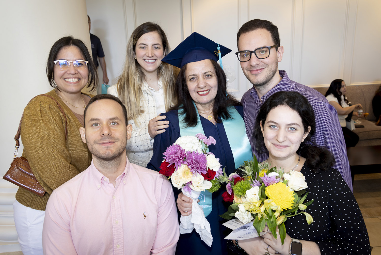 Graduate Mouna Abbas with her family