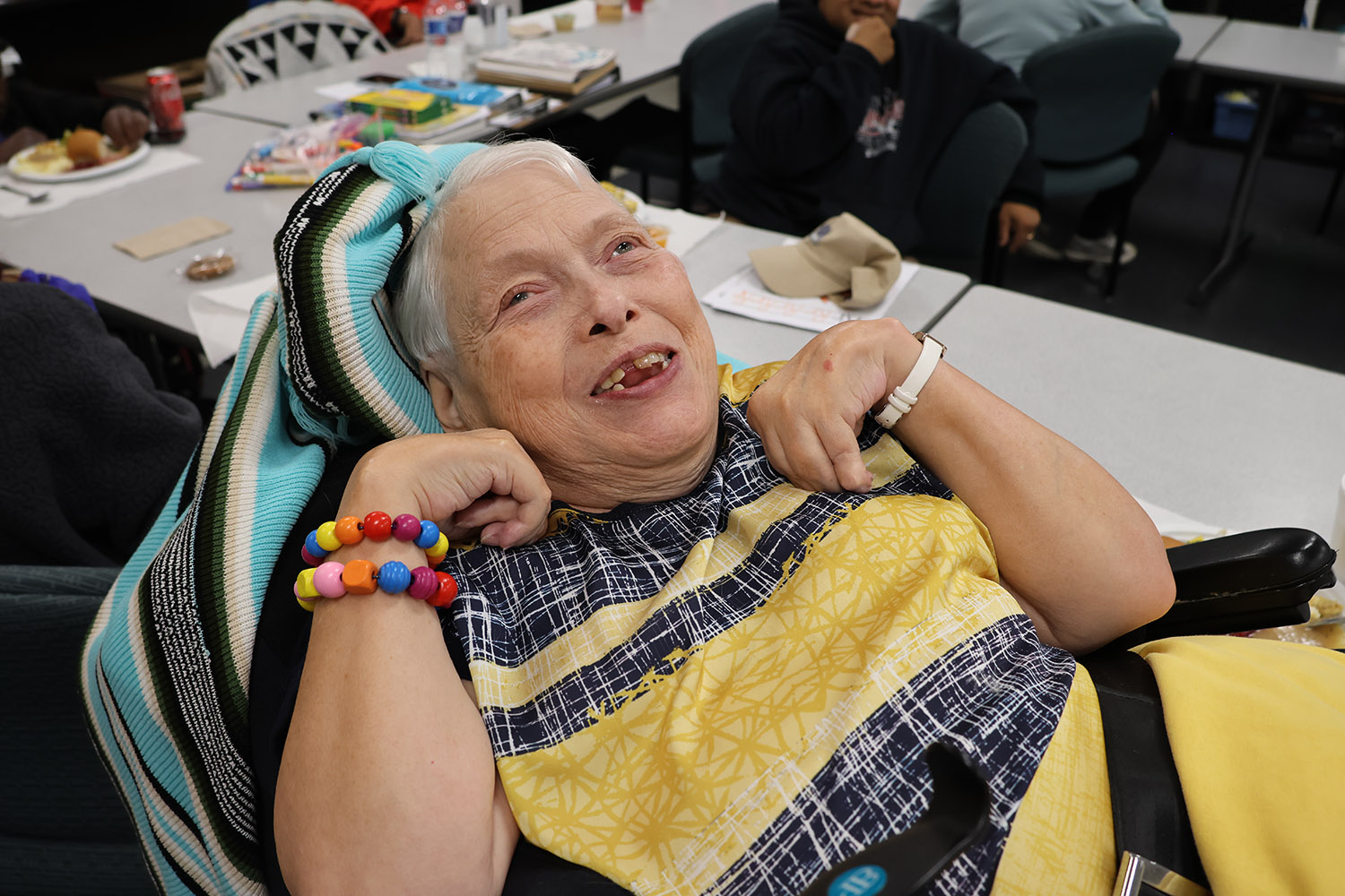 Ability Connection member Nina enjoys lunch during the annual Ability Connection Thanksgiving feast on Friday, November 22, 2024.