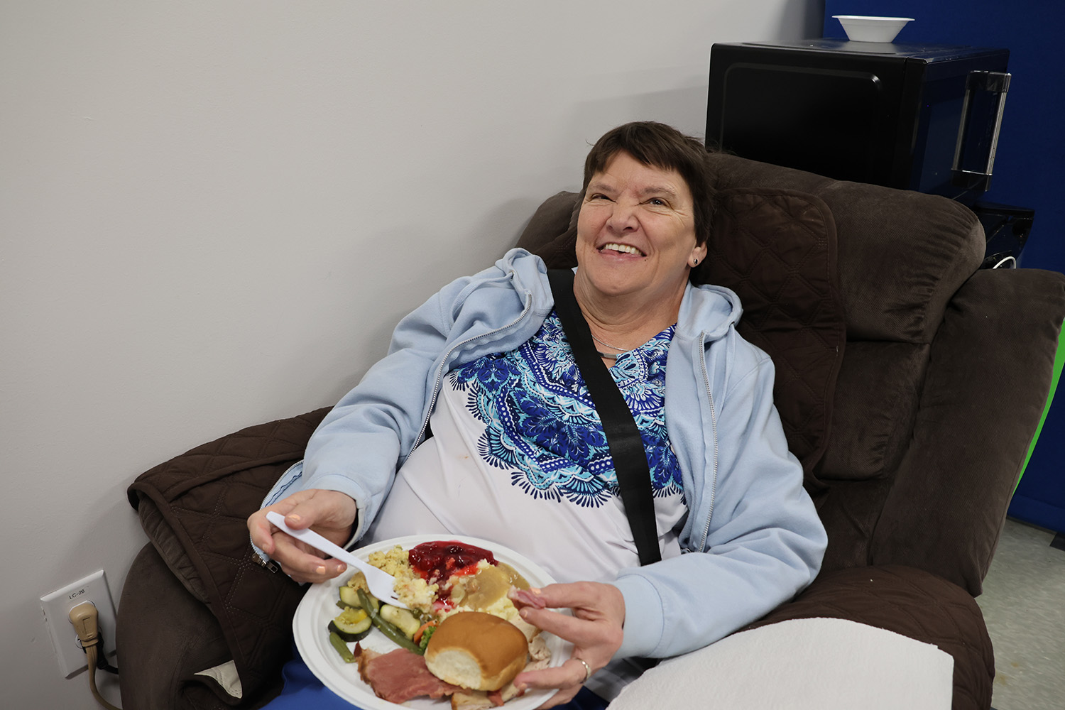 Jane is all smiles at the Ability Connection Training Center during the organization’s annual Thanksgiving feast on Friday, November 22, 2024.