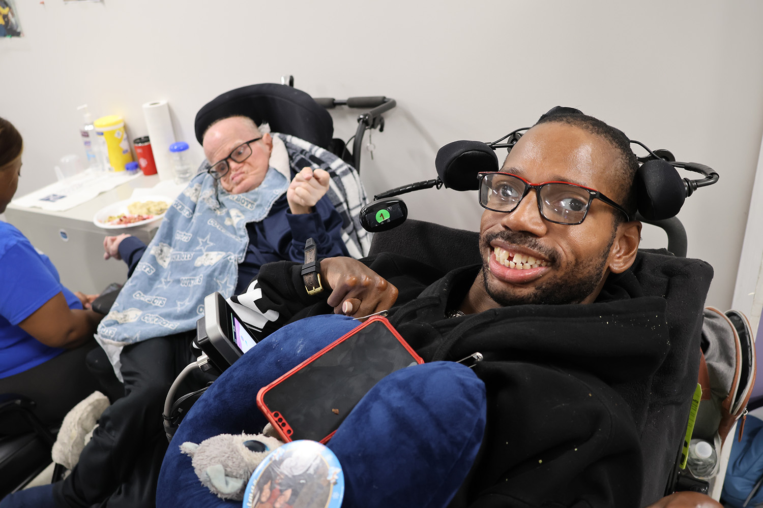 Ability Connection members David and Marcus celebrate during the Ability Connection annual Thanksgiving feast on Friday, November 22, 2024.