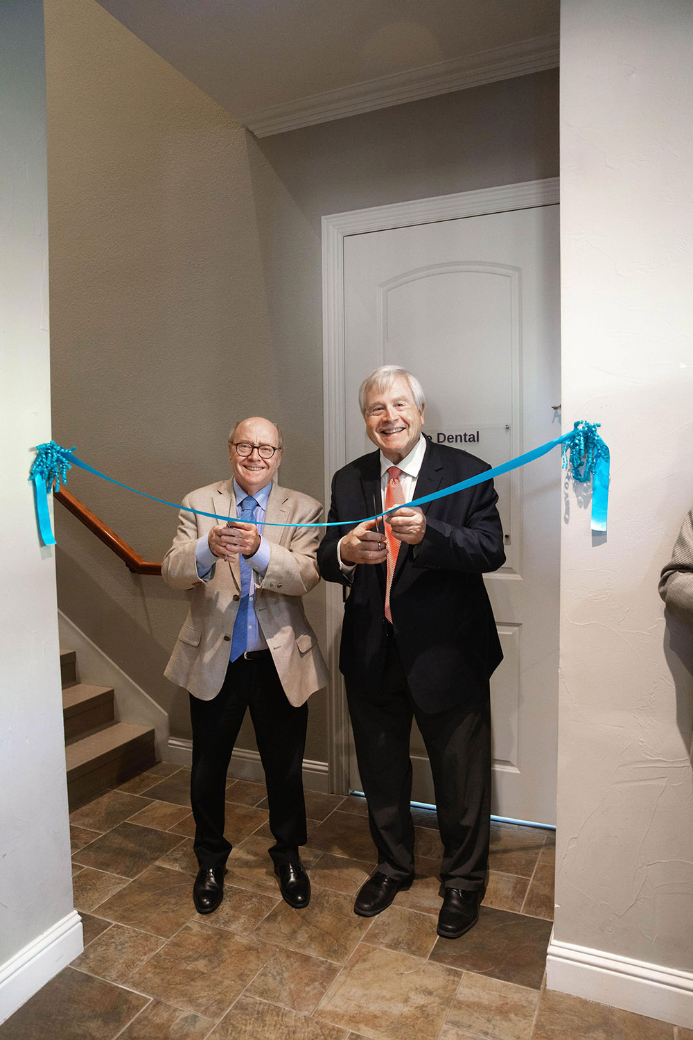 Ribbon cutting with executive director Paul Hoffmann and board chair Richard Sanford at the Agape Clinic Dental Center grand opening